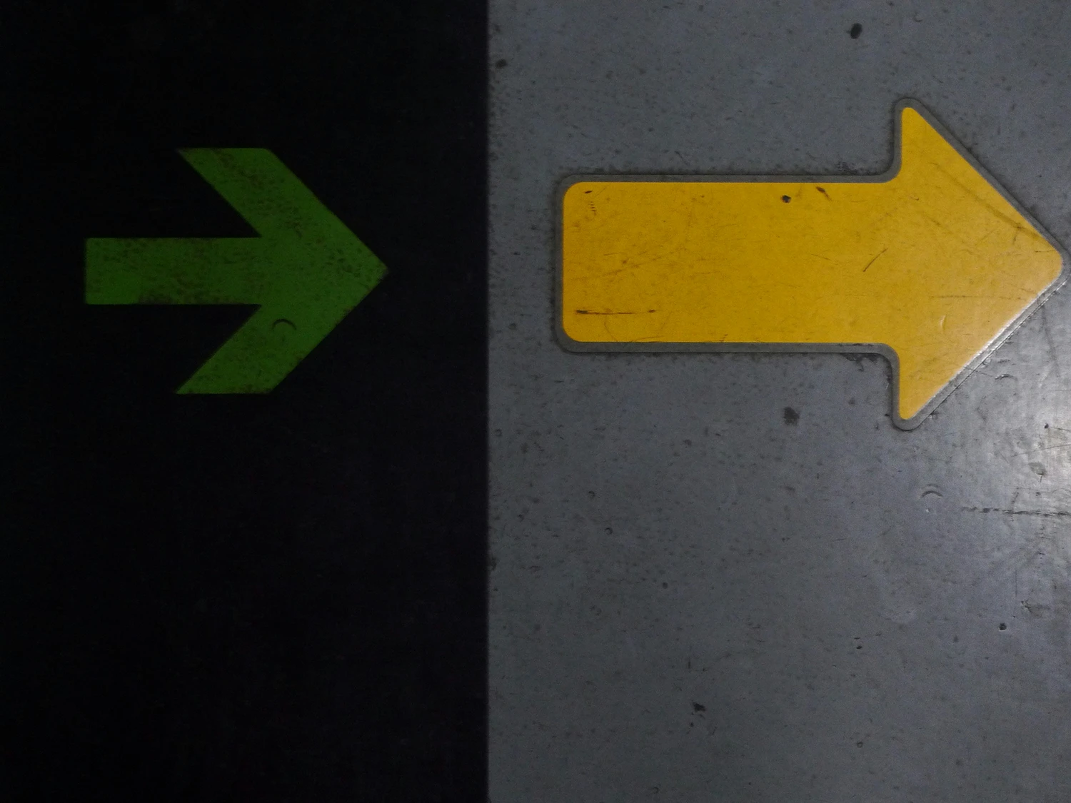 Two directional arrows pointing toward different paths
